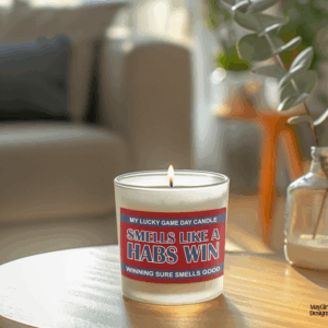 Handmade 14oz soy wax game day candle in frosted glass jar with team colors and label reading “Smells Like a [Team Name] Win.”