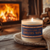 Handmade 14oz soy wax game day candle in frosted glass jar with team colors and label reading “Smells Like a [Team Name] Win.”