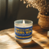 Handmade 14oz soy wax game day candle in frosted glass jar with team colors and label reading “Smells Like a [Team Name] Win.”