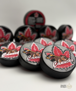 Custom personalized keepsake hockey pucks featuring team logos, player of the game designs, season details, and team roster layouts