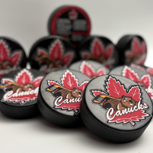 Custom personalized keepsake hockey pucks featuring team logos, player of the game designs, season details, and team roster layouts