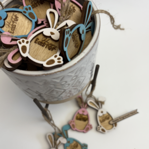 Laser cut wooden bunny Easter gift tags, hand painted and personalized with names, shown in natural wood and pastel colours