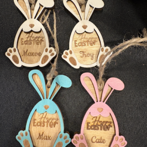 Laser cut wooden bunny Easter gift tags, hand painted and personalized with names, shown in natural wood and pastel colours