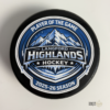 Custom personalized keepsake hockey pucks featuring team logos, player of the game designs, season details, and team roster layouts