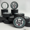 Custom personalized keepsake hockey pucks featuring team logos, player of the game designs, season details, and team roster layouts