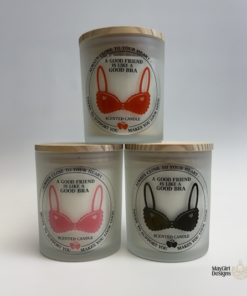 Set of frosted glass scented candles with funny bra-themed friendship labels in pink, red, and black designs