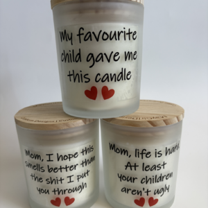 Cheeky handmade mom candles in frosted glass jars with funny Mother’s Day sayings and bamboo lids by MayGirl Designs.