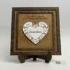 Personalized wooden puzzle heart frame with family names and the message you are the piece that holds us together