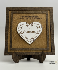 Personalized wooden puzzle heart frame with family names and the message you are the piece that holds us together