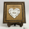 Personalized wooden puzzle heart frame with family names and the message you are the piece that holds us together