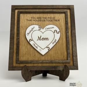 Personalized wooden puzzle heart frame with family names and the message you are the piece that holds us together