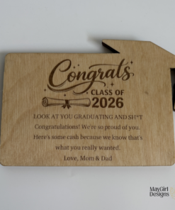 Custom wooden graduation money holders with engraved Class of designs, including cap and diploma details.
